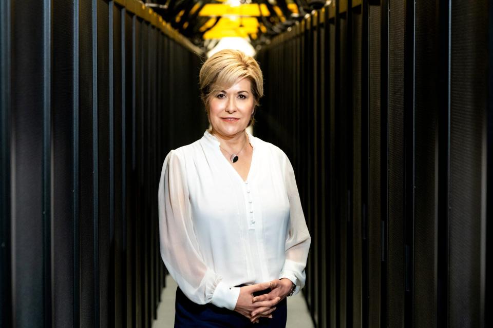 Gina Tourassi with the Frontier supercomputer, the world's fastest supercomputer, which she said is a leader in the use of artificial intelligence (AI) for solving scientific problems. Frontier is located at Oak Ridge National Laboratory.
