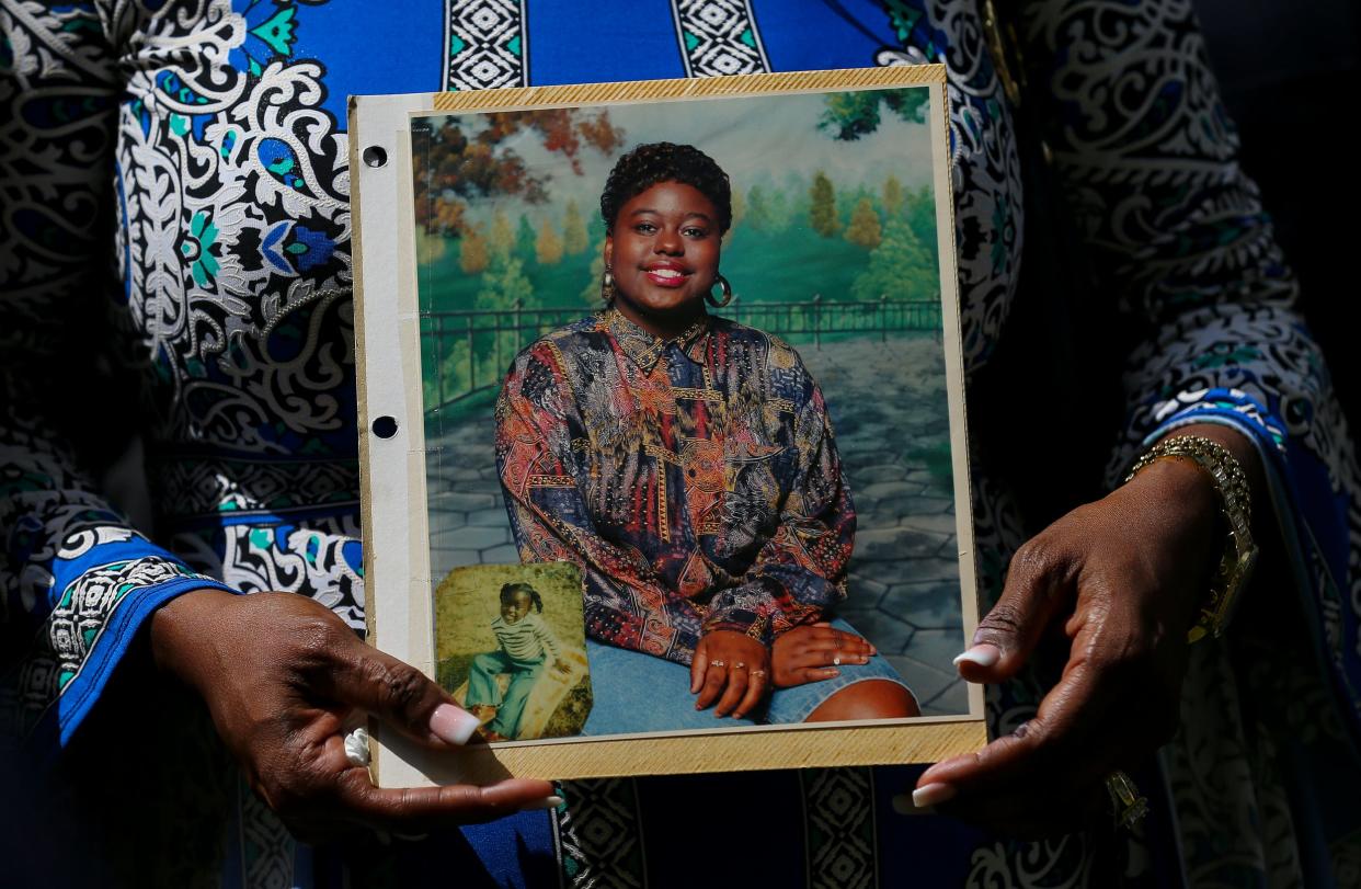 In this May 16, 2019 file photo, Antoinette Dorsey-James holds a picture of her sister Pamela Turner during a news conference outside the Harris County Civil Court in Houston. Baytown Police Officer Juan Delacruz has been charged with assault for fatally shooting Turner in the parking lot of an apartment complex where they both lived in May 2019 prosecutors announced Monday, Sept. 14, 2020. (Godofredo A Vasquez/Houston Chronicle via AP File) ORG XMIT: TXHOU403