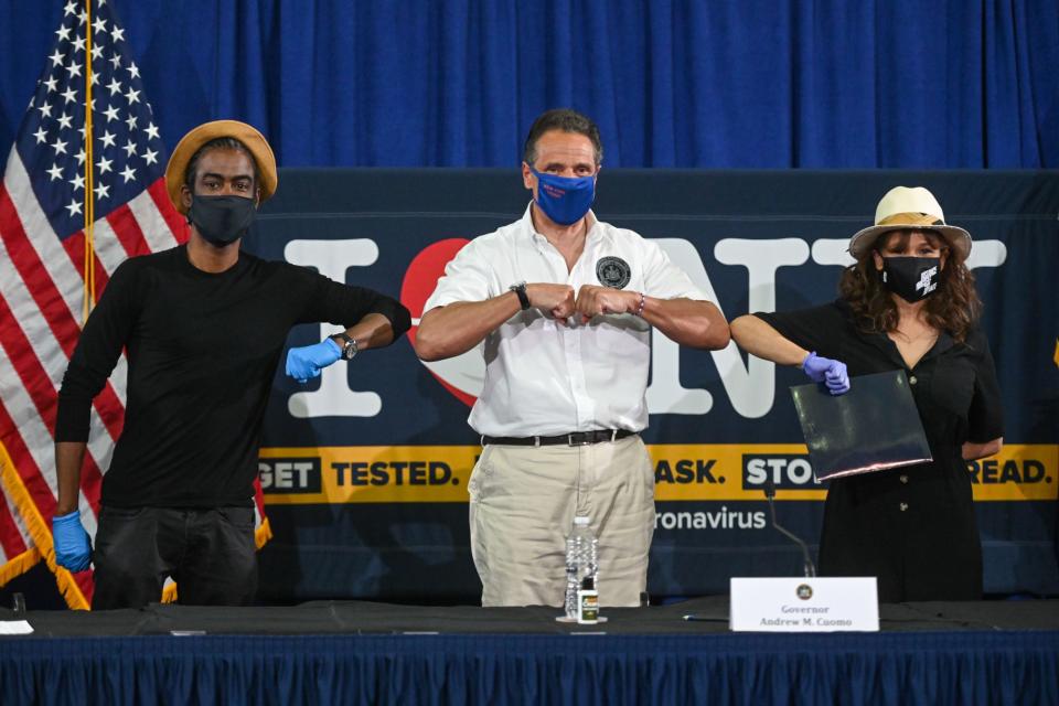 <p>Governor Andrew Cuomo gets elbow bumps from Chris Rock and Rosie Perez on Thursday as the stars join him to promote mask use in New York before businesses reopen. </p>