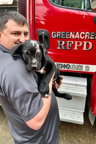 <p>Jenifer Alcorn, Executive Director South Coast Humane Society, www.mysouthcoasthumane.org</p> Smoky the puppy with the firefighter who adopted him after the dog was rescued from a burning home