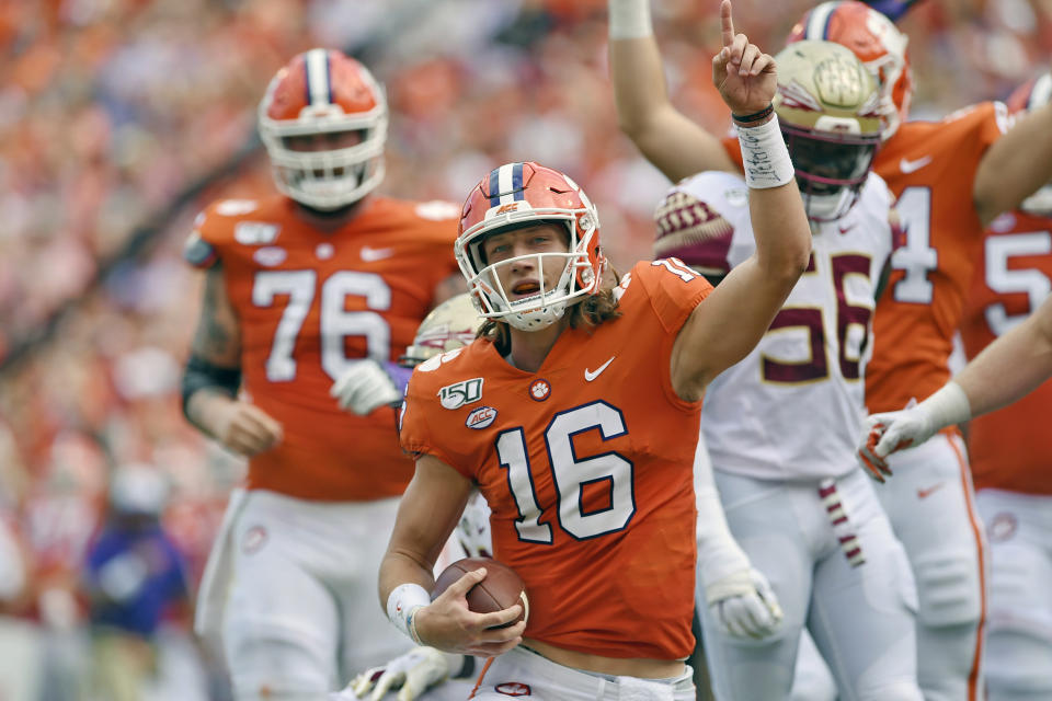 FILE - In this Oct. 12, 2019, filer photo, Clemson quarterback Trevor Lawrence (16) reacts after scoring a touchdown during the first half of an NCAA college football game against Florida State, in Clemson, S.C. Clemson is preseason No. 1 in The Associated Press Top 25, Monday, Aug. 24, 2020.(AP Photo/Richard Shiro, File)