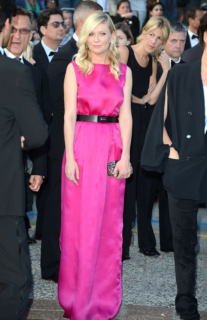 A few hours later, "On the Road" premiered at the Cannes Film Festival, and Kirsten was once again dressed to impress. This time, the 30-year-old screen siren opted for a fuchsia Christian Dior column gown, sleek black belt, and an array of Louis Vuitton jewels. (5/23/2012)