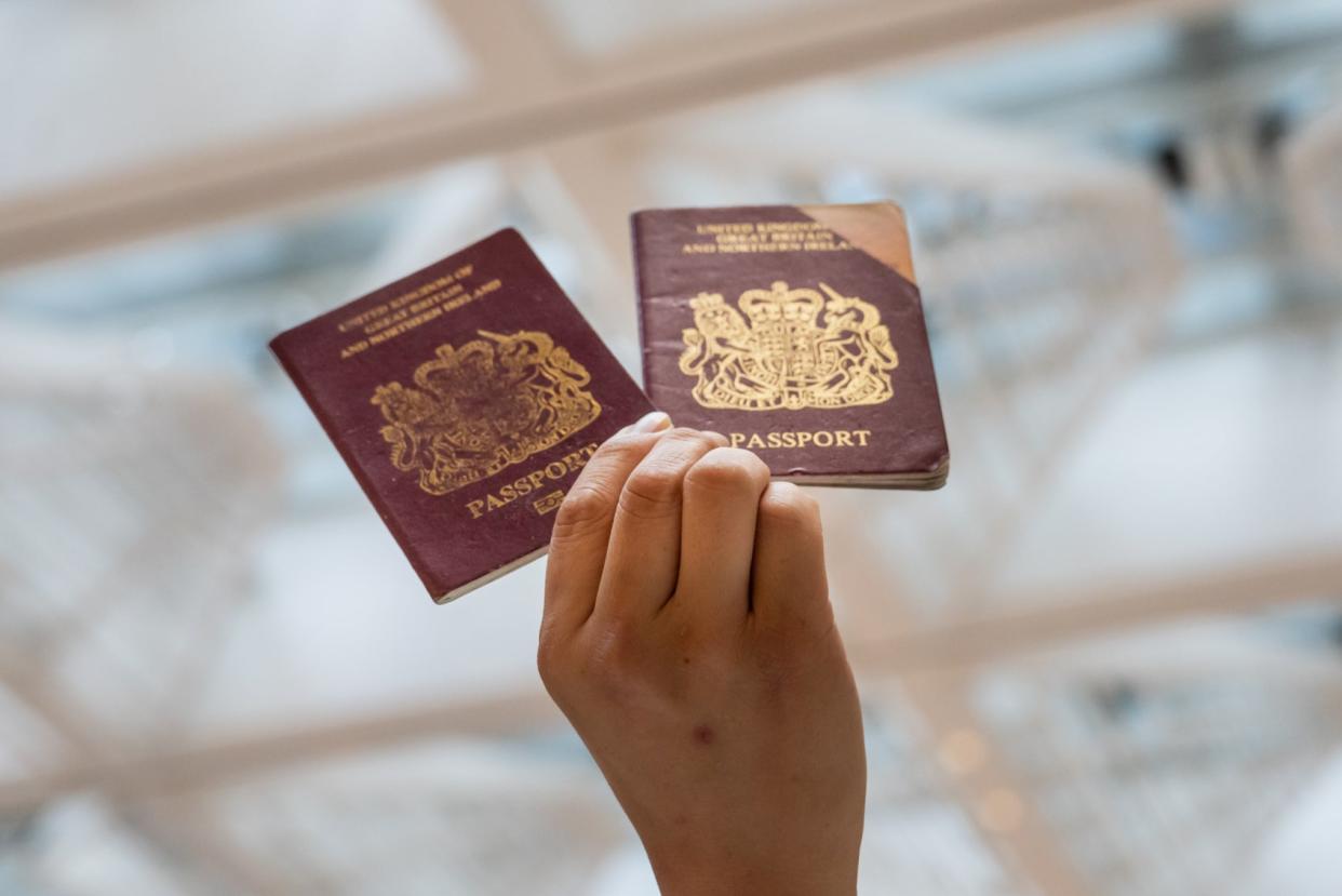 <p>A pro-democracy protester holds a British passport during a Lunch With You rally on June 1, 2020 in Hong Kong</p> (Getty Images)