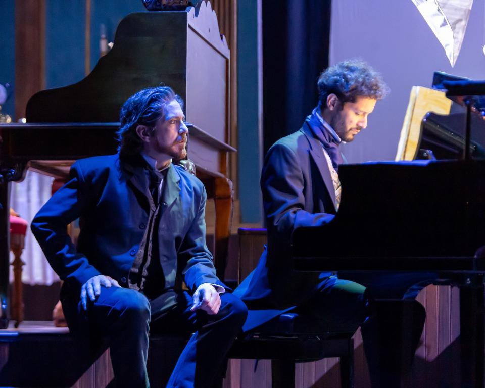 Matthew Alvin Brown, left, who stars as Pyotr Ilyich Tchaikovsky, watches pianist Joao Pedro Pena Dutra play during a performance of Lyric Theatre's world-premiere production of "Concerto," a fact-based play by Alan Olejniczak.