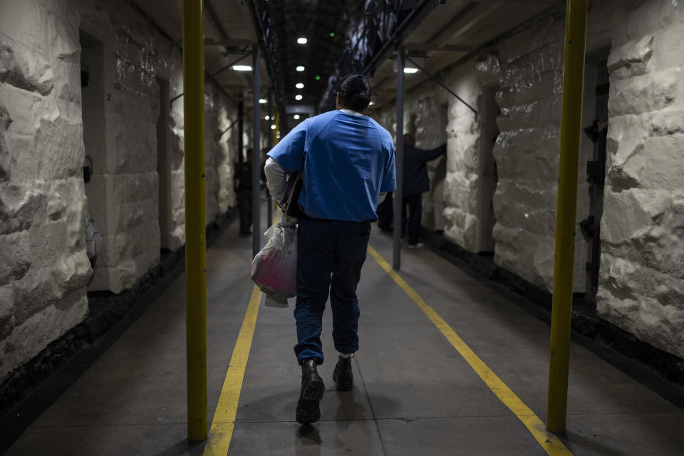 Gerald Massey, an incarcerated student majoring communications through the Transforming Outcomes Project at Sacramento State (TOPSS), walks to his cell after class at Folsom State Prison in Folsom, Calif., Wednesday, May 3, 2023. Massey, one of 11 Folsom students graduating with a degree from the California State University at Sacramento, has served nine years of a 15-to-life sentence for a drunken driving incident that killed his close friend. “The last day I talked to him, he was telling me, I should go back to college,” Massey said. “So when I came into prison and I saw an opportunity to go to college, I took it.” (AP Photo/Jae C. Hong)