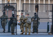 National Guard troops keep watch at the Capitol in Washington, early Thursday, March 4, 2021, amid intelligence warnings that there is a "possible plot" by a group of militia extremists to take control of the Capitol on March 4 to remove Democrats from power. The threat comes nearly two months after thousands of supporters of then-President Donald Trump stormed the Capitol in a violent insurrection as Congress was voting to certify Joe Biden's electoral win. (AP Photo/J. Scott Applewhite)