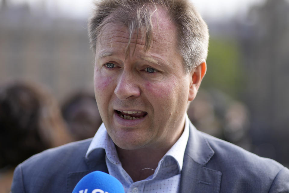 FILE - In this Thursday. Sept. 23, 2021 file photo, Richard Ratcliffe, the husband of imprisoned British-Iranian Nazanin Zaghari-Ratcliffe gives a television interview in Parliament Square, London, whilst marking the 2,000 days she has been detained in Iran. The husband of U.K. charity worker Nazanin Zaghari-Ratcliffe, who has been detained more than five years in Iran, has gone on a hunger strike again after a court decided she has to spend another year in prison. (AP Photo/Matt Dunham, File)