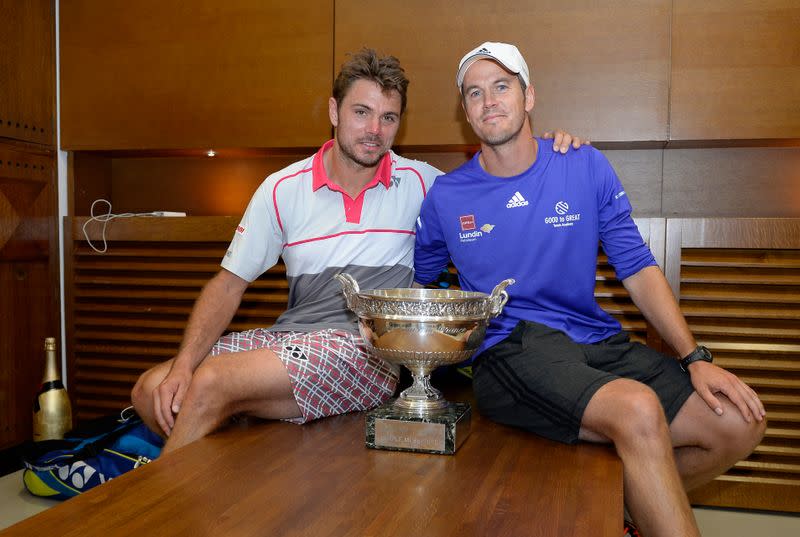 Stan Wawrinka of Switzerland poses with his trophy in the dressing room after winning the men's singles final match against Novak Djokovic of Serbia during the French Open tennis tournament at the Roland Garros stadium in Paris