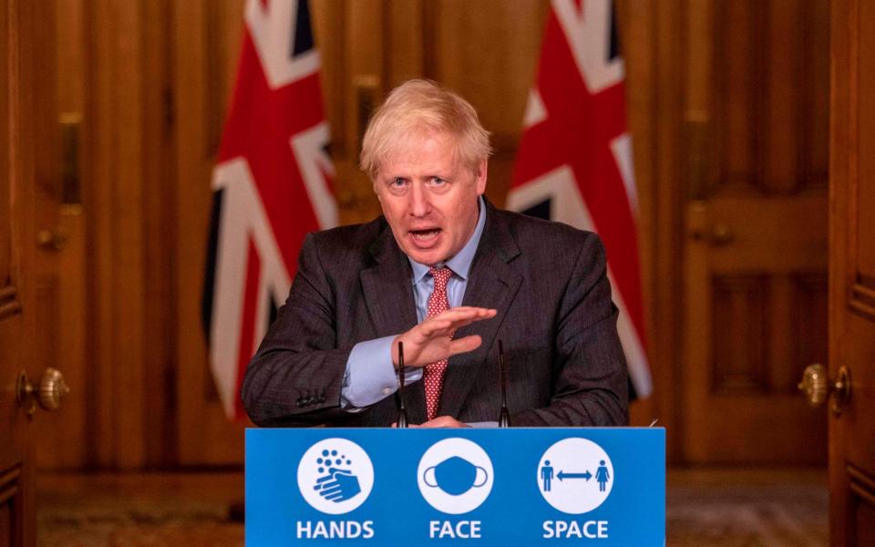 Britain's Prime Minister Boris Johnson speaks at a remote press conference to update the nation on the Covid-19 pandemic - AFP