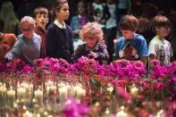 Unidentified relatives and friends of the victims of Malaysian Airlines MH17 attend a national memorial at the RAI convention center in Amsterdam November 10, 2014. REUTERS/Frank van Beek/Pool