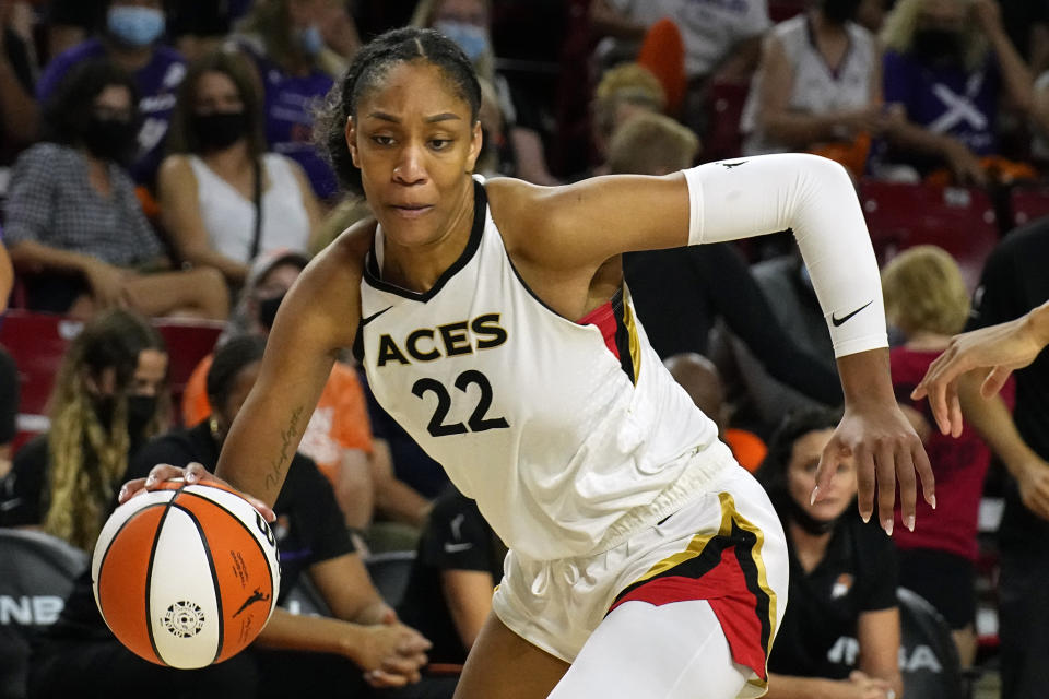 FILE - Las Vegas Aces forward A'ja Wilson (22) plays during the first half of a WNBA basketball game against the Phoenix Mercury, Sunday, Oct. 3, 2021, in Phoenix. Wilson was named AP Defensive Player of the Year Tuesday, Aug. 16, 2022. (AP Photo/Rick Scuteri, File)