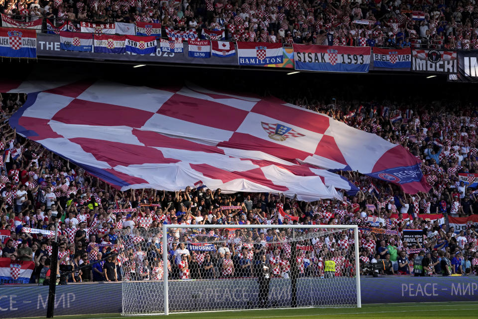 Croatia fans cheer on the stands during the Nations League semifinal soccer match between the Netherlands and Croatia at De Kuip stadium in Rotterdam, Netherlands, Wednesday, June 14, 2023. (AP Photo/Peter Dejong)