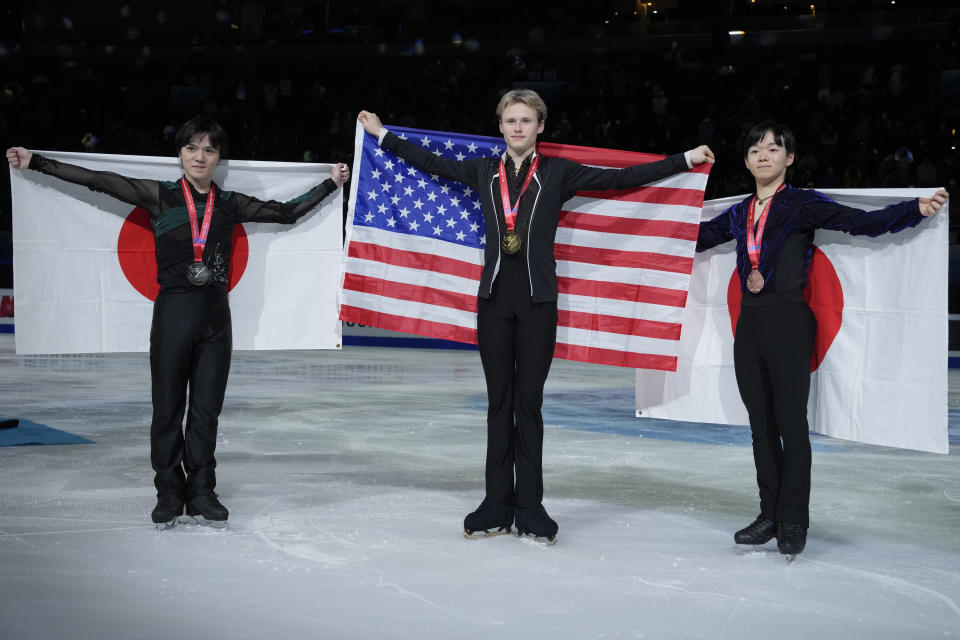 From left silver medalist Japan's Shoma Uno, gold medalist United State's Ilia Malinin and bronze medalist Japan's Yuma Kagiyama pose for photos during the victory ceremony for the Men's Final in the ISU Grand Prix of Figure Skating Final held in Beijing, Saturday, Dec. 9, 2023. (AP Photo/Ng Han Guan)