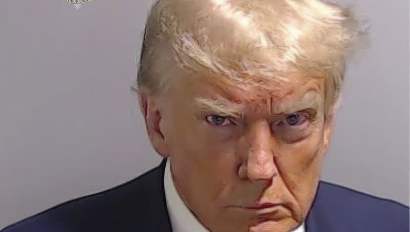 This booking photo provided by Fulton County Sheriff’s Office, shows former President Donald Trump on Thursday, Aug. 24, 2023, after he surrendered and was booked at the Fulton County Jail in Atlanta. Trump is accused by District Attorney Fani Willis of scheming to subvert the will of Georgia voters in a desperate bid to keep Joe Biden out of the White House.