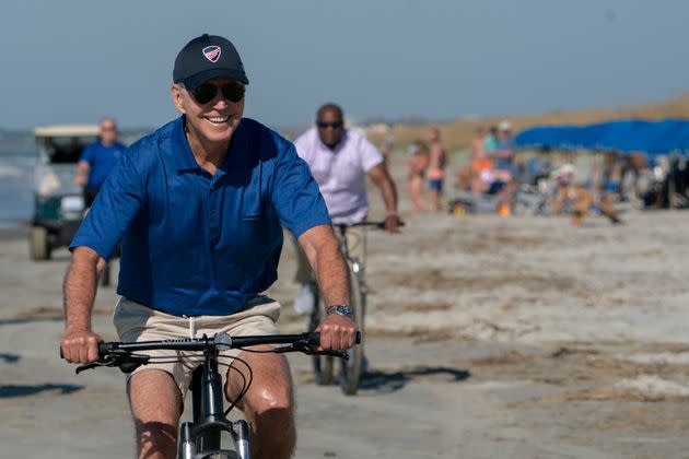 President Joe Biden rides a bicycle along the beach at Kiawah Island, South Carolina, on Aug. 14, 2022. (Photo: Manuel Balce Ceneta/Associated Press)