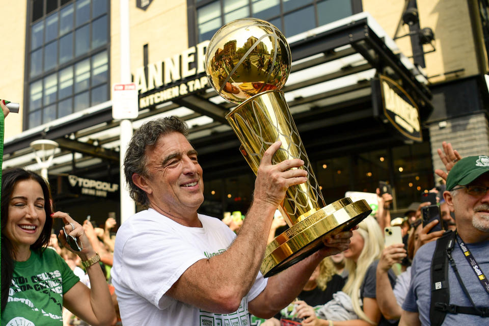 BOSTON, MASSACHUSETTS - JUNE 21: Owner Wyc Grousbeck of the Boston Celtics reacts as he holds the Larry O'Brien Championship Trophy during the 2024 Boston Celtics championship parade following their 2024 NBA Finals win on June 21, 2024 in Boston, Massachusetts.  (Photo by Billie Weiss/Getty Images)