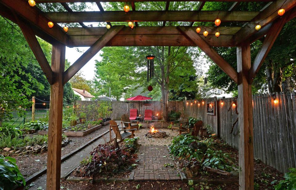 A pergola-covered patio provides a nice setting for evening dinners.