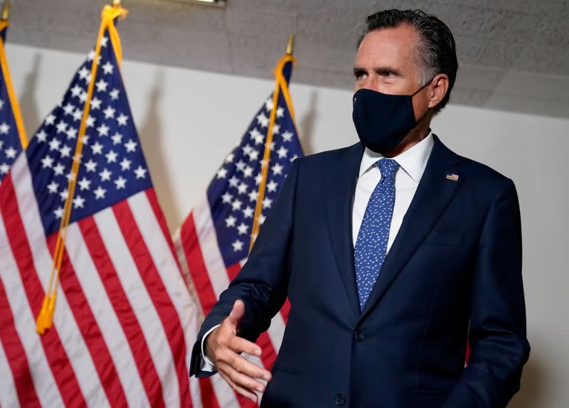 FILE PHOTO: U.S. Senator Mitt Romney arrives at a luncheon on Capitol Hill