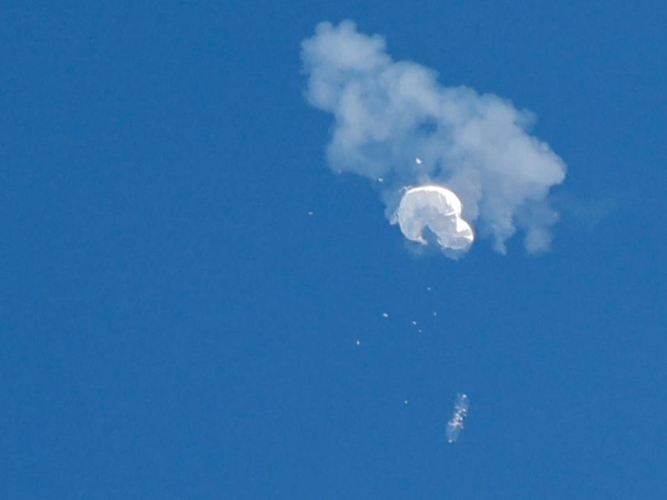 The suspected Chinese spy balloon drifts to the ocean after being shot down off the coast in Surfside Beach, South Carolina, U.S. February 4, 2023.