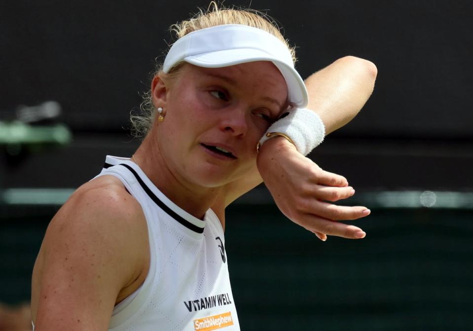 Harriet Dart wipes away tears during her match with Katie Boulter (EPA)