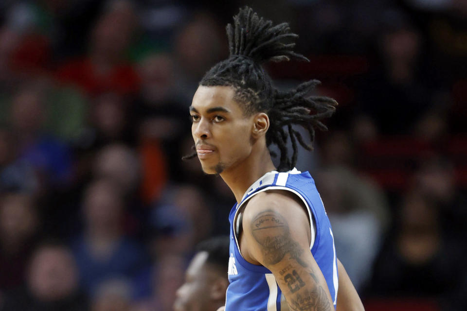 FILE - Then-Memphis forward Emoni Bates looks on during the first half of a first-round NCAA college basketball tournament game against Boise State, on March 17, 2022, in Portland, Ore. Bates has officially transferred to Eastern Michigan. The school announced Tuesday, Aug. 23, 2022, that the 6-foot-9 guard will play for his hometown Eagles this season, nearly two months after Bates shared his plans on social media. (AP Photo/Craig Mitchelldyer, File)