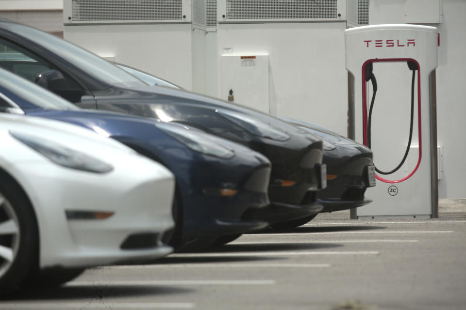 A Tesla supercharging location is seen on Kipling Street, June 3, 2024 in Houston. Charging stations have been hit particularly hard by thieves who likely want to sell the highly conductive copper wiring inside the cables at near-record prices. But authorities and charging company officials say similar thefts are increasing across the U.S. as more charging stations are built. (AP Photo/Lekan Oyekanmi)