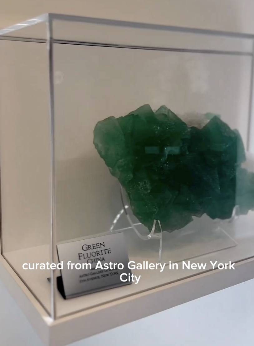 A closeup of Green Fluorite in a glass case in Dr. Shafer's office