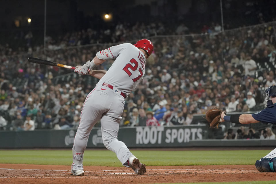 Los Angeles Angels' Mike Trout hits a solo home run against the Seattle Mariners during the third inning of the second baseball game of a doubleheader Saturday, June 18, 2022, in Seattle. (AP Photo/Ted S. Warren)