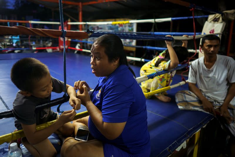 The Wider Image: Punching out of poverty: Despite risks, nine-year-old Thai fighter eager to return to ring