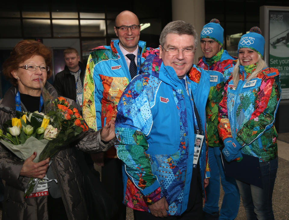 International Olympic Committee President Thomas Bach, center right, arrives at Sochi International Airport prior to the Sochi 2014 Winter Olympics on Friday, Jan. 31, 2014 in Sochi, Russia. The Olympic games will run from Feb. 7-23. (AP Photo/Matthew Stockman, Pool)