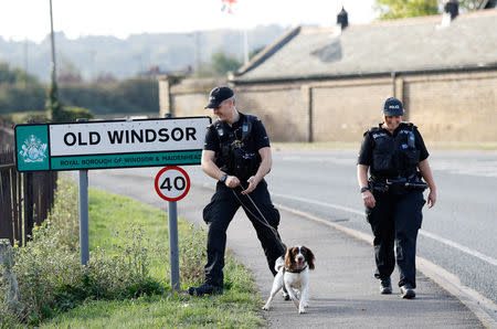 Police officers perform a search a day ahead of the royal wedding between Princess Eugenie and Jack Brooksbank in Windsor, Britain, October 11, 2018. REUTERS/Peter Nicholls