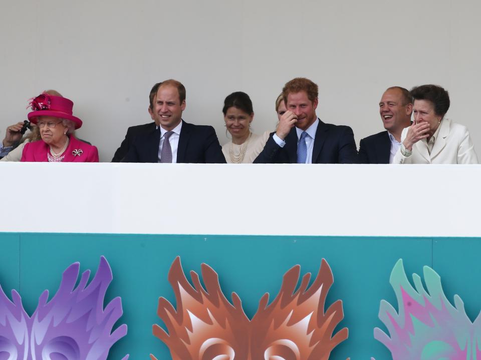 Britain's Prince Harry (3R), Mike Tindall (2R) and Britain's Princess Anne, Princess Royal (R) share a joke as Britain's Prince William, Duke of Cambridge (2L) and Britain's Queen Elizabeth II watch the Patron's Lunch, a special street party outside Buckingham Palace in London on June 12, 2016, as part of the three day celebrations for Queen Elizabeth II's official 90th birthday. - Up to 10,000 people are expected to attend the Patron's Lunch along with the monarch, her husband Prince Philip, Prince William and Prince Harry. (Photo by JUSTIN TALLIS / AFP) (Photo by JUSTIN TALLIS/AFP via Getty Images)