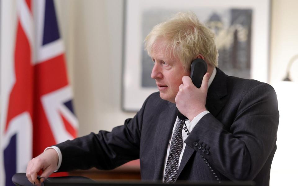 Boris Johnson speaks on the telephone from inside his office in No10 Downing Street, to the President of the European Commission Ursula von der Leyen  - No10 Downing Street