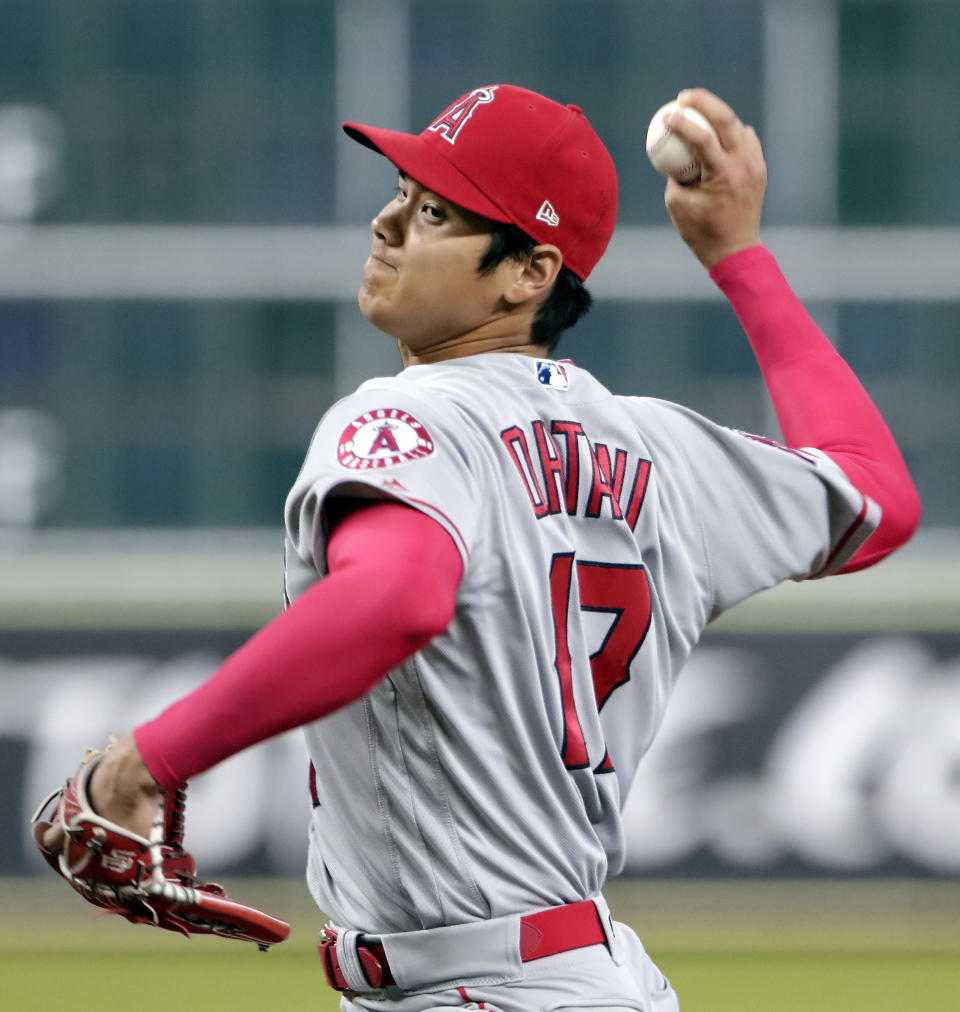 Los Angeles Angels starting pitcher Shohei Ohtani (17) throws against the Houston Astros during the first inning of a baseball game Sunday, Sep. 2, 2018, in Houston. (AP Photo/Michael Wyke)