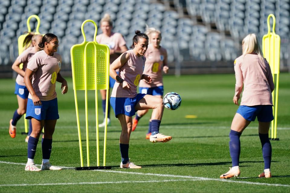 Jess Carter and Lucy Bronze in training (PA)