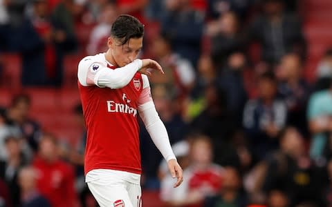 Mesut Ozil reacts after defeat to Manchester City - Credit: Reuters