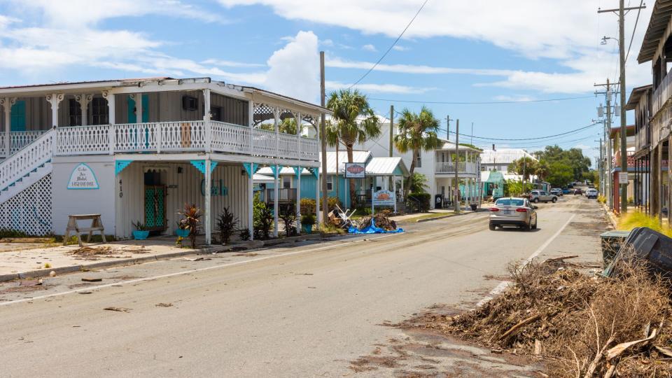 Debris piled on the main street of Cedar Key, FL following Hurricane Idalia in August, 2023.