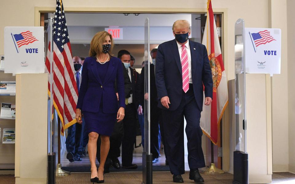 Donald Trump leaves the polling station after casting his ballot - AFP 