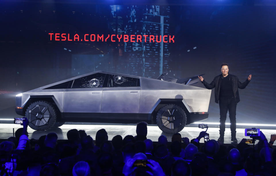 FILE - In this Nov. 21, 2019 file photo, Tesla CEO Elon Musk introduces the Cybertruck at Tesla's design studio in Hawthorne, Calif. The much-hyped unveil of Tesla’s electric pickup truck went off script Thursday night when supposedly unbreakable window glass shattered twice when hit with a large metal ball. The failed stunt, which ranks high on the list of embarrassing auto industry rollouts, came just after Musk bragged about the strength of “Tesla Armor Glass” on the wedge-shaped “Cybertruck.” (AP Photo/Ringo H.W. Chiu, File)