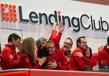 FILE PHOTO: Renaud Laplanche, (2nd R) Founder and CEO of Lending Club, celebrates with company executives after ringing the opening bell during their IPO at the New York Stock Exchange (NYSE) in New York, U.S., December 11, 2014. REUTERS/Brendan McDermid/File Photo