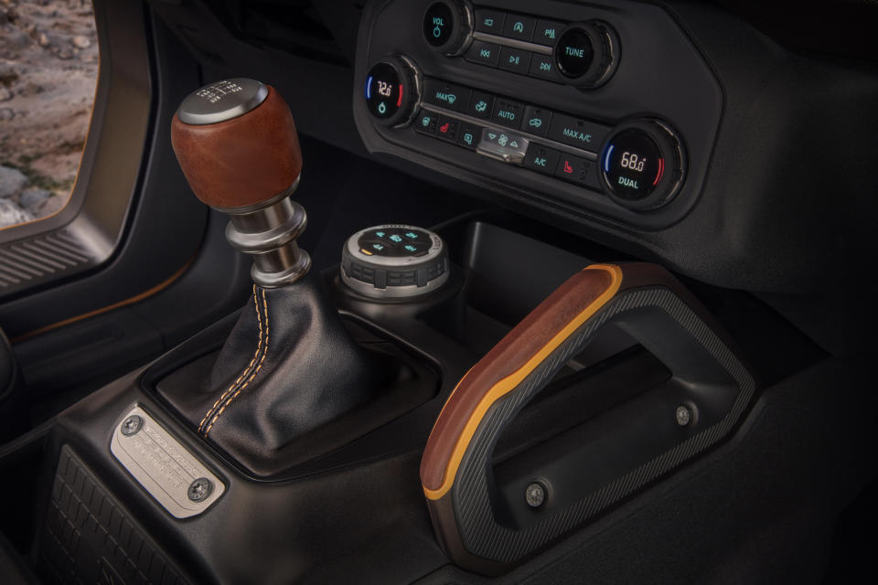 Customization details include an available leather-wrapped shift lever for the class-exclusive 7-speed manual transmission, as well as grab handles in this prototype version of the 2021 Bronco (not representative of production model). (Static display on private property with aftermarket accessories not available for sale.)