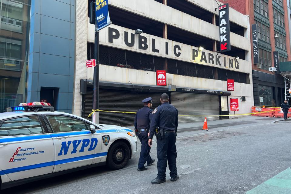 NYPD officers at the scene of the parking garage collapse in Lower Manhattan