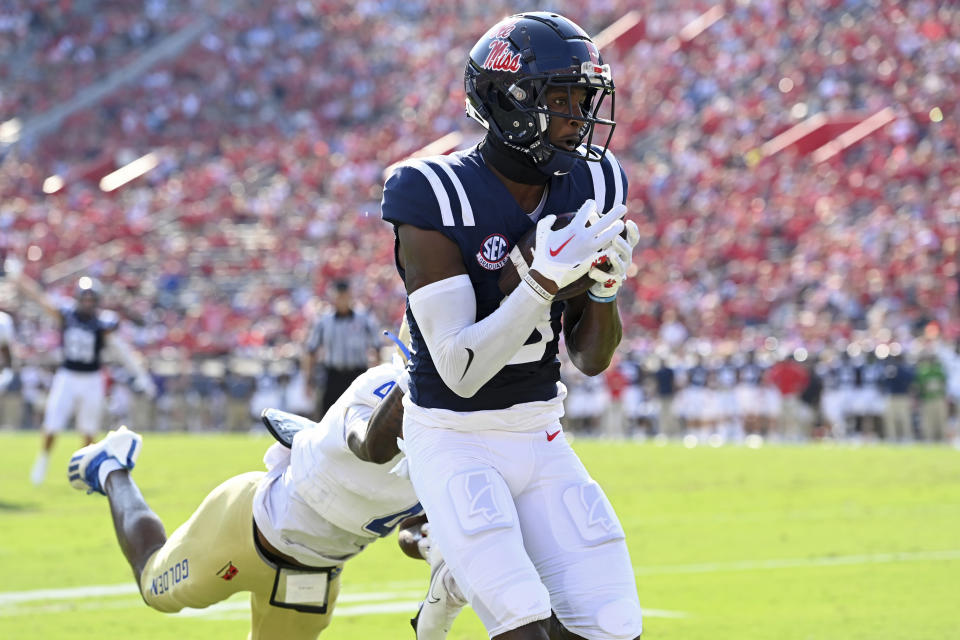 Mississippi wide receiver Malik Heath (8) catches a touchdown pass past Tulsa cornerback Tyree Carlisle (4) during the first half of an NCAA college football game in Oxford, Miss., Saturday, Sept. 24, 2022. (AP Photo/Thomas Graning)