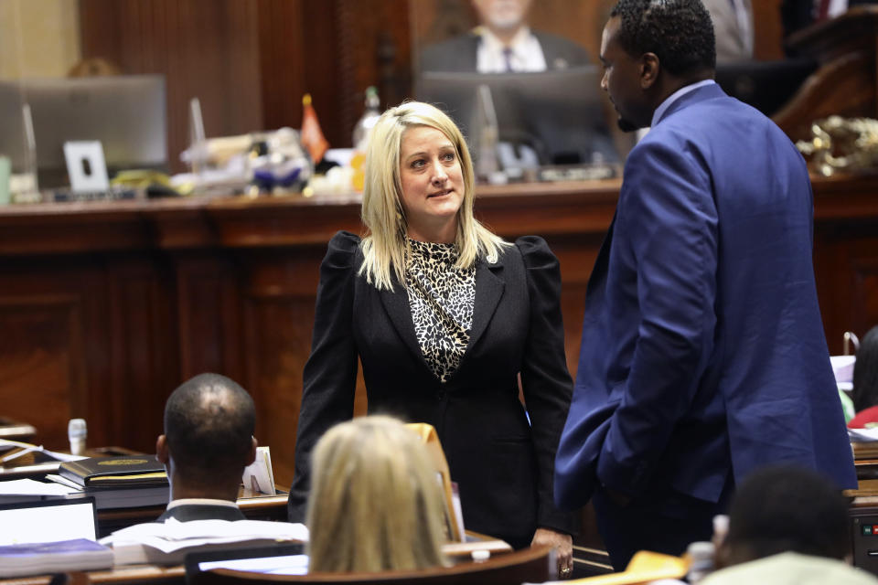 South Carolina Rep Ashley Trantham, R-Pelzer, talks to other lawmakers during a debate on the bill she sponsored to ban transgender athletes from girls' and women's public school and college sports teams on Tuesday, April 5, 2022, in Columbia, S.C. (AP Photo/Jeffrey Collins)