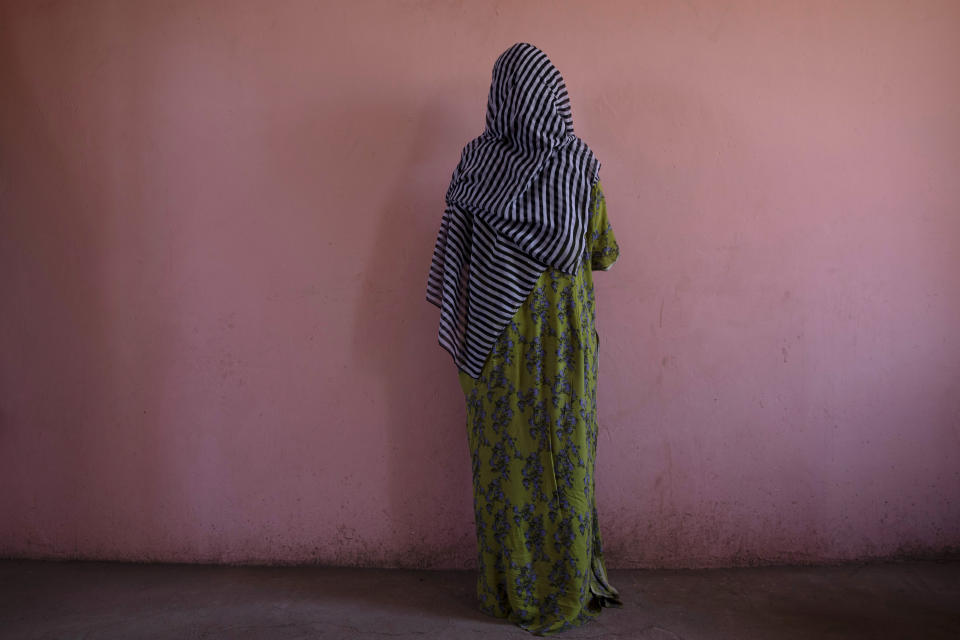 A Tigrayan woman who says she was gang raped by Amhara fighters, stands for a portrait in eastern Sudan, near the border with Ethiopia, on March 23, 2021. "Let the Tigray government come and help you," she recalled them saying, even while they were raping her. (AP Photo/Nariman El-Mofty)