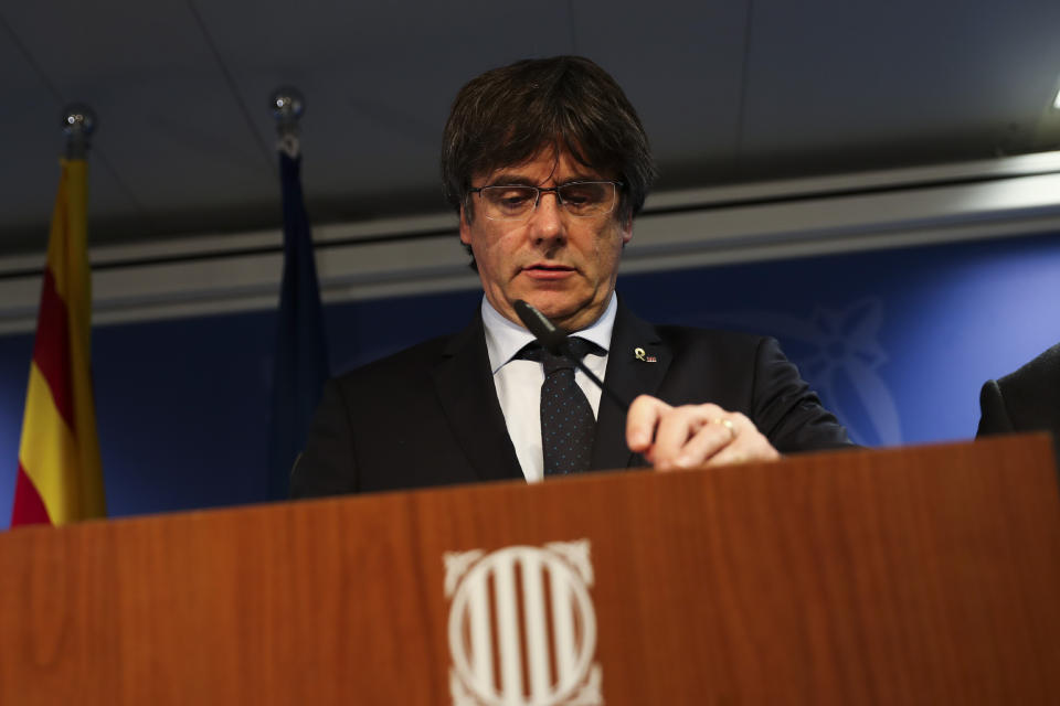 Catalonia's former regional president Carles Puigdemont arrives to give a statement in Brussels, Monday, Oct. 14, 2019. A dozen Catalan politicians and activists have been convicted on charges of sedition, misuse of public funds and disobedience for their role in an illegal and failed secession attempt for the northeastern region of Spain in 2017. (AP Photo/Francisco Seco)