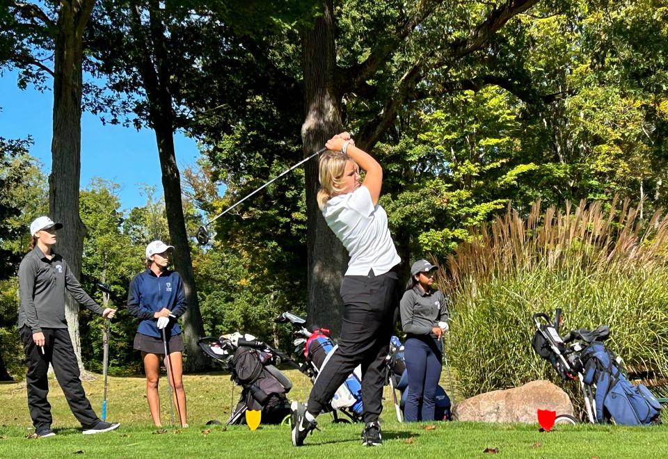 Fort LeBoeuf's Cassidy Conn, watched by playing partners Brooke Hart of Meadville and Bella Deaton and Genelia Kang of McDowell, hits her tee shot on The County Club of Meadville's seventh hole during Wednesday's District 10 Class 3A girls golf tournament. Conn won the 36-hole competition by four strokes over Deaton.