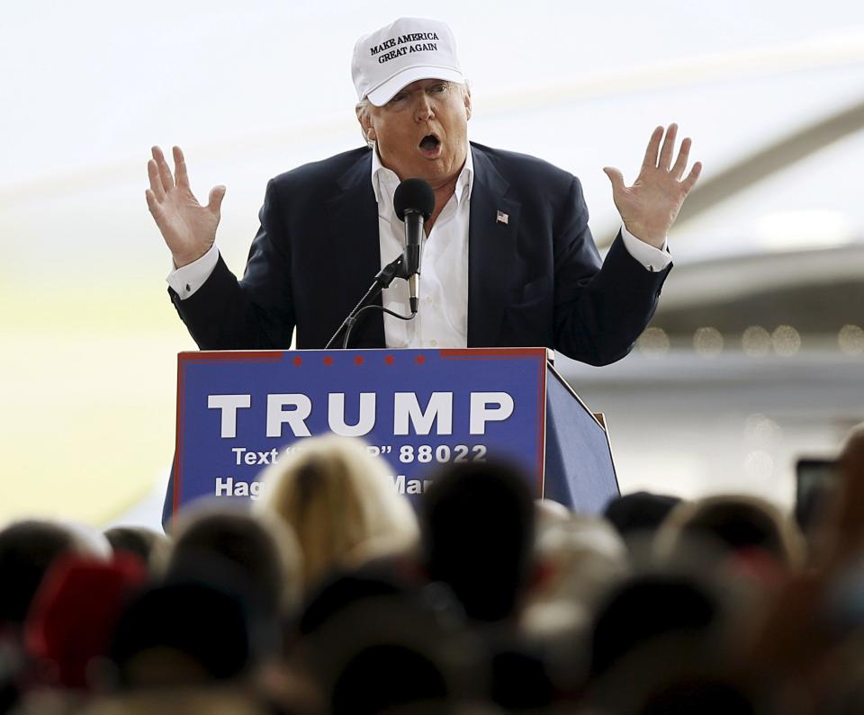 Republican presidential candidate Donald Trump speaks at a campaign rally in front of his personal helicopter after landing at the airport in Hagerstown, Maryland, April 24, 2016.