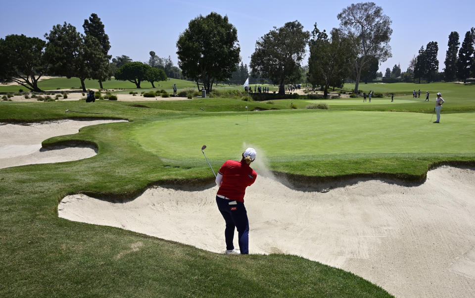 Ariya Jutanugarn, of Thailand, hits out of a bunker on the fourth hole during the first round of the HUGEL-Air Premia LA Open golf tournament at Wilshire Country Club Thursday, April 25, 2019, in Los Angeles. (AP Photo/Mark J. Terrill)