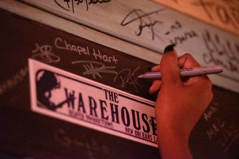 Chapel Hart signs their names on “The Porch” at Ground Zero Blues Club in Biloxi on Wednesday, Nov. 30, 2022. Every artist that performs at Ground Zero is asked to sign the wall. Hannah Ruhoff/The Sun Herald